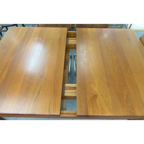 291 - A Heal & Son Ltd teak dining table, raised on turned, straight, tapered legs  29