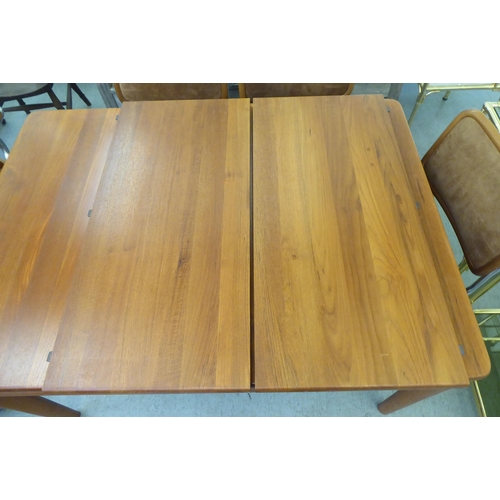 291 - A Heal & Son Ltd teak dining table, raised on turned, straight, tapered legs  29