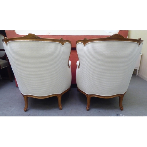 318 - A pair of mid 20thC Louis XVI design giltwood framed salon chairs, upholstered in cream coloured fab... 