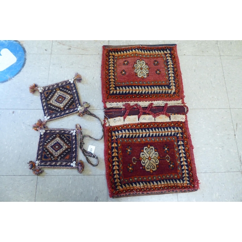 321 - Rugs, saddle bags and textiles: to include a Persian bag  32