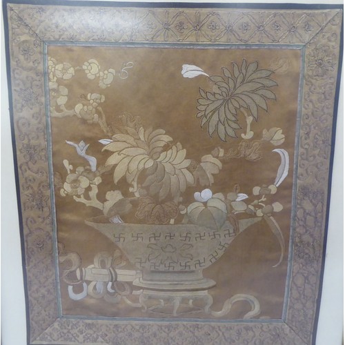 302 - An early 20thC Chinese embroidered panel, depicting a vase and flowers  18