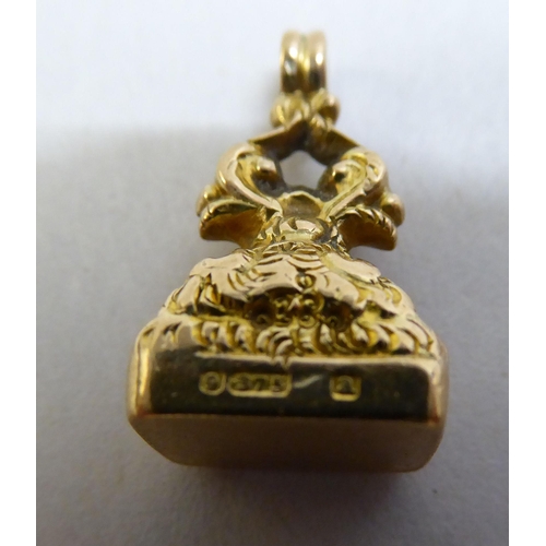 10 - A 9ct gold ring; and a 9ct gold fob seal 