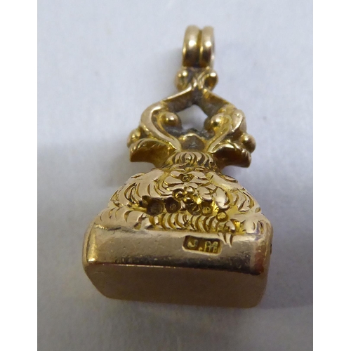 10 - A 9ct gold ring; and a 9ct gold fob seal 