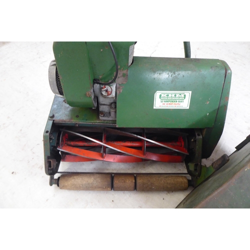 100 - A vintage KHM petrol driven lawnmower with a 16