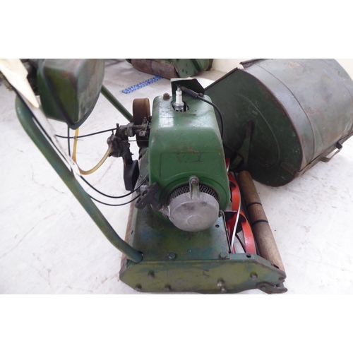 100 - A vintage KHM petrol driven lawnmower with a 16