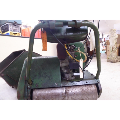 100 - A vintage KHM petrol driven lawnmower with a 16