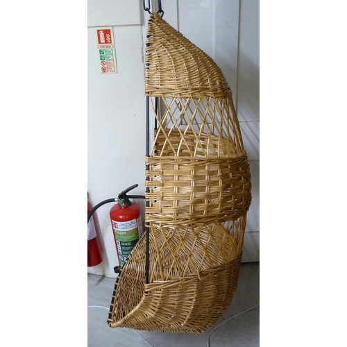 115 - A metal framed and woven cane 'Egg' hanging chair, on chain