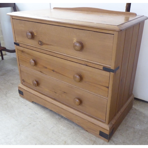 120 - A 20thC pine three drawer dressing chest, on a bracket plinth  26