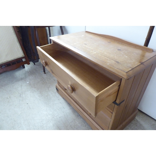 120 - A 20thC pine three drawer dressing chest, on a bracket plinth  26