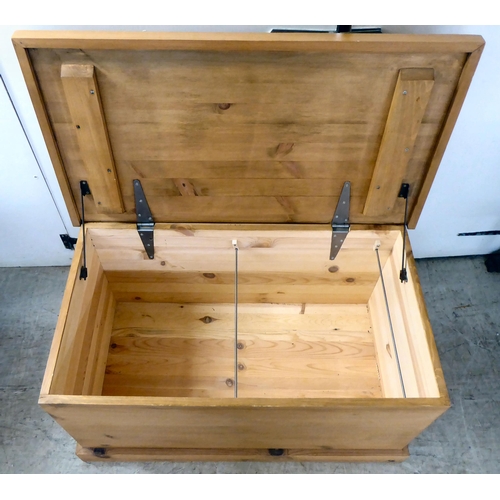 124 - A modern pine chest with straight sides and a hinged lid, on a plinth  19