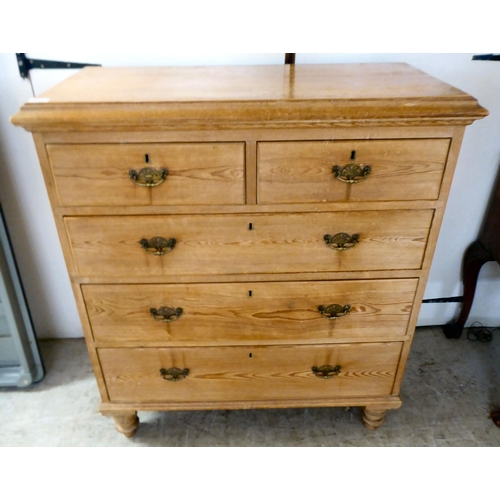 125 - An early 20thC pine five drawer dressing chest, raised on turned legs  42