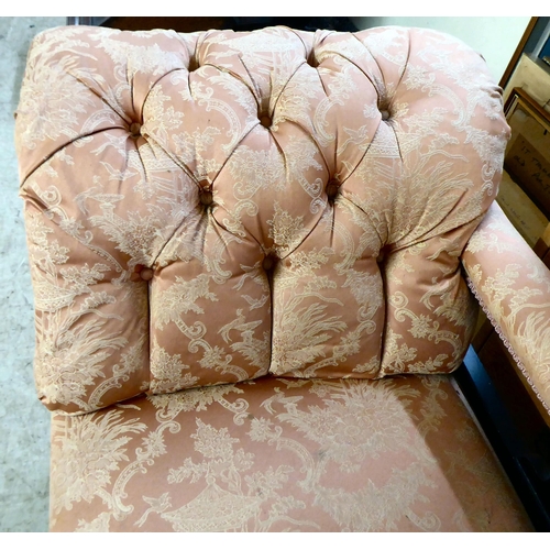 130 - An Edwardian black painted showwood framed chaise longue, upholstered in Oriental patterned fabric, ... 