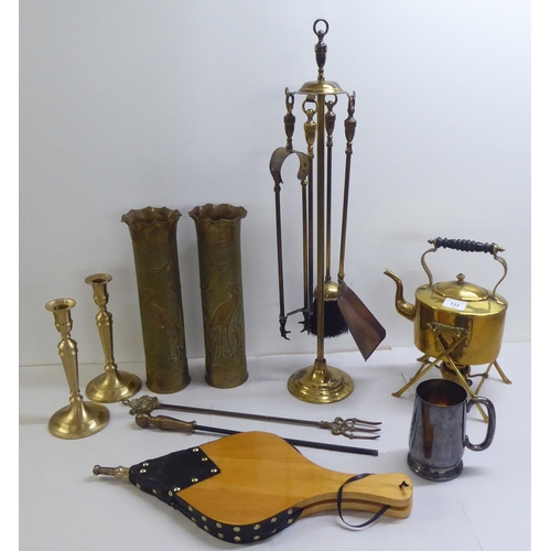 131 - A mixed lot: to include a late Victorian brass spirit kettle with an ebonised handle