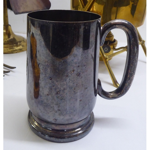 131 - A mixed lot: to include a late Victorian brass spirit kettle with an ebonised handle