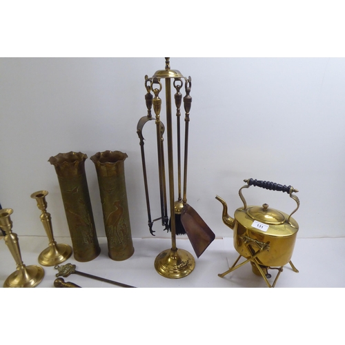 131 - A mixed lot: to include a late Victorian brass spirit kettle with an ebonised handle