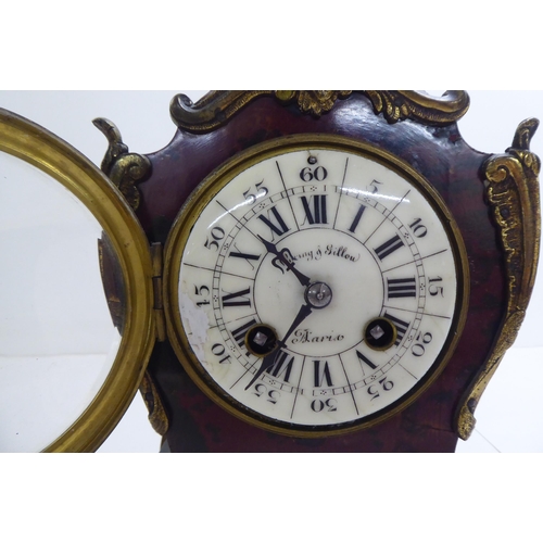 134 - A late Victorian Waring & Gillow faux tortoiseshell painted wood mantel clock with ormolu mounts... 