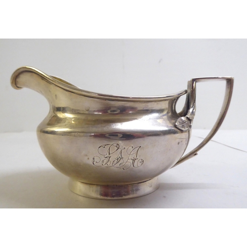 140 - A George III silver milk jug of squat, bulbous form  London 1804