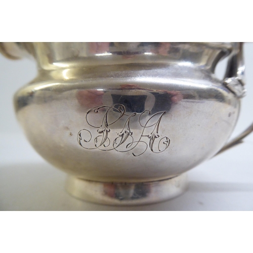 140 - A George III silver milk jug of squat, bulbous form  London 1804