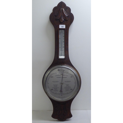 145 - A mixed lot: to include a 1930s oak barometer with a silvered dial  31