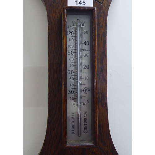 145 - A mixed lot: to include a 1930s oak barometer with a silvered dial  31