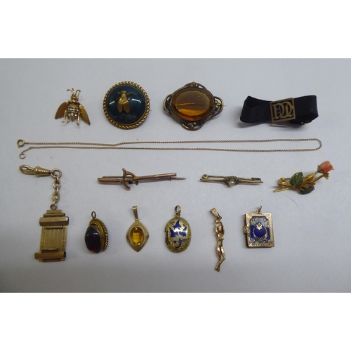 169 - Victorian and later yellow metal jewellery and collectables: to include a mourning brooch, decorated... 