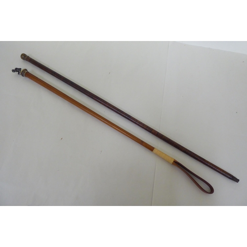 185 - An early 20thC leather walking cane  35