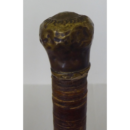 185 - An early 20thC leather walking cane  35