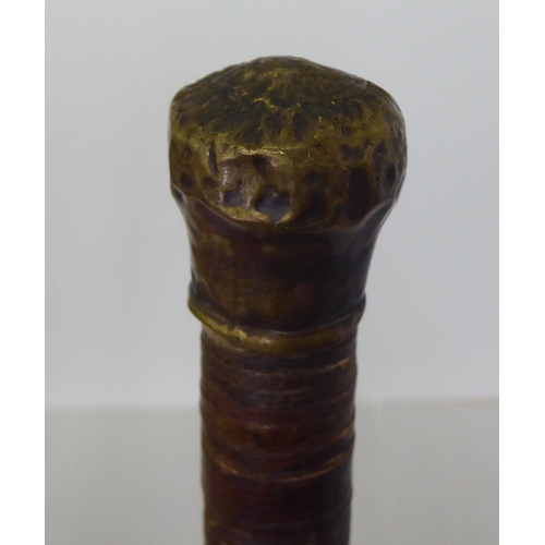 185 - An early 20thC leather walking cane  35