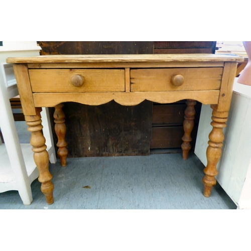 187 - A modern rustic pine side table with two frieze drawers, raised on turned legs  30.5