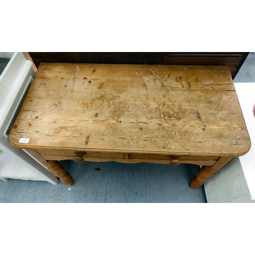 187 - A modern rustic pine side table with two frieze drawers, raised on turned legs  30.5