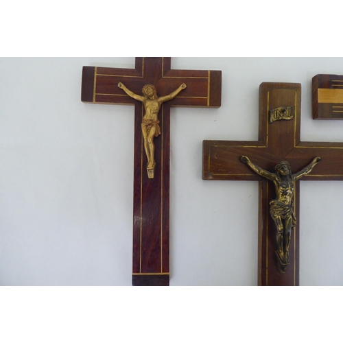 195 - Four similar crucifixes, each affixed with a cast metal Corpus Christie  largest 14