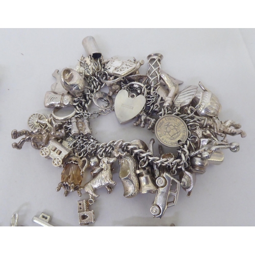 196 - Silver and white metal charms and bracelets  various designs