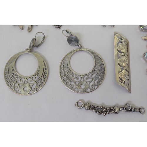 205 - Silver and white metal jewellery: to include a charm bracelet