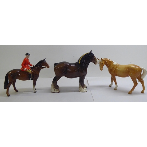 21 - Five Beswick pottery model horses and ponies: to include a 'Huntsman'  8.5