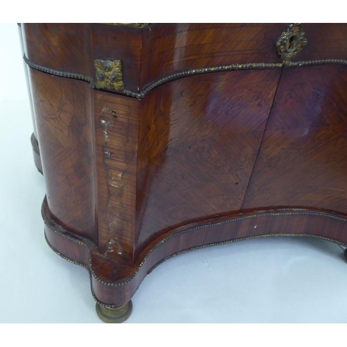 224 - A late 19thC Continental kingswood decanter box, decorated with brass beadwork, the domed parquetry ... 