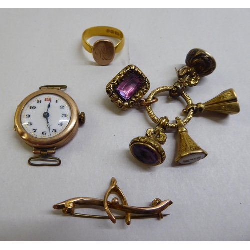 23 - Yellow metal and gold items of personal ornament: to include a 9ct gold ladies wristwatch, faced by ... 