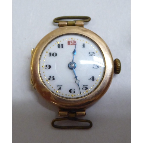 23 - Yellow metal and gold items of personal ornament: to include a 9ct gold ladies wristwatch, faced by ... 