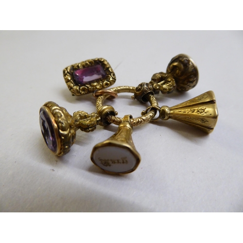 23 - Yellow metal and gold items of personal ornament: to include a 9ct gold ladies wristwatch, faced by ... 