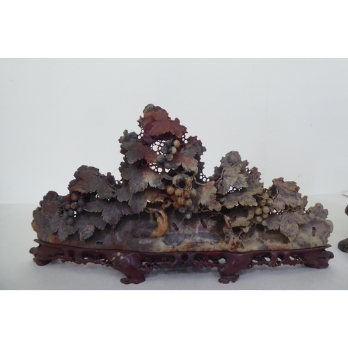 230 - Two pieces of Chinese soapstone ornament, viz. one depicting a mountainous village, on stand  1... 