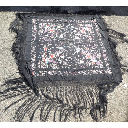 236 - An Oriental black embroidered piano shawl, decorated with flowers, birds and insects