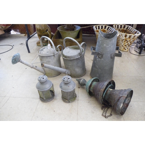 239 - Cast metal garden items: to include watering cans  15