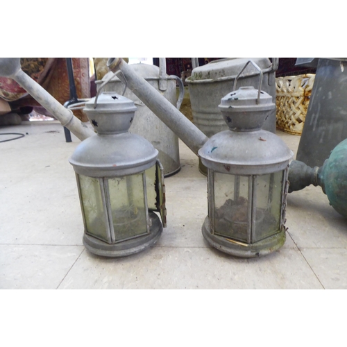 239 - Cast metal garden items: to include watering cans  15