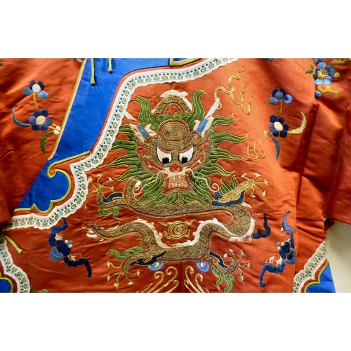 247 - A Chinese red fabric jacket, embroidered with dragons