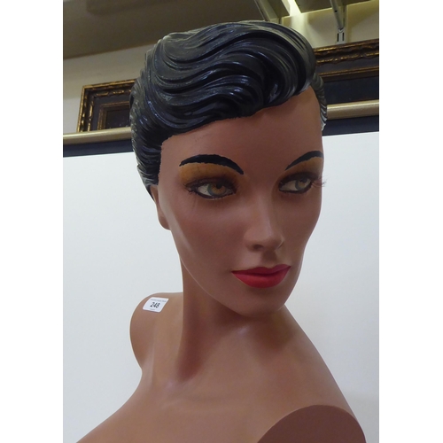 248 - A painted resin mannequin bust of a woman  30.5