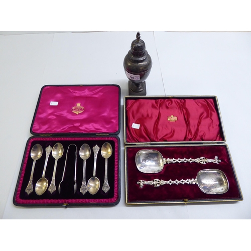 25 - A set of six presentation spoons; a silver pedestal caster; and a pair of silver plated presentation... 