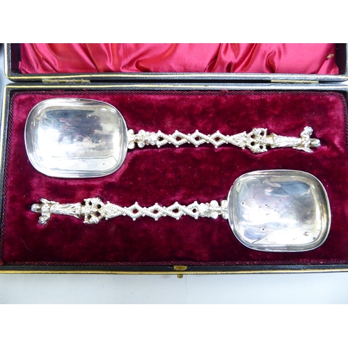 25 - A set of six presentation spoons; a silver pedestal caster; and a pair of silver plated presentation... 