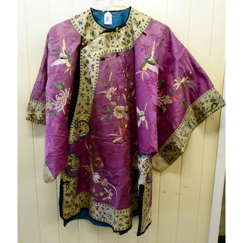 252 - A Chinese pink fabric jacket, embroidered with flowers