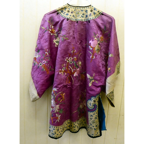 252 - A Chinese pink fabric jacket, embroidered with flowers