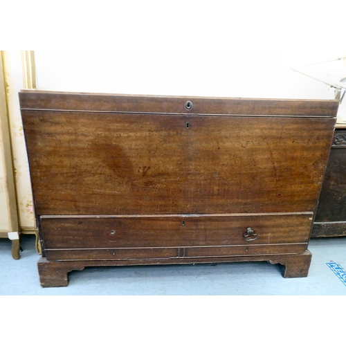 255 - An early 19thC oak mule chest, raised on bracket feet  34