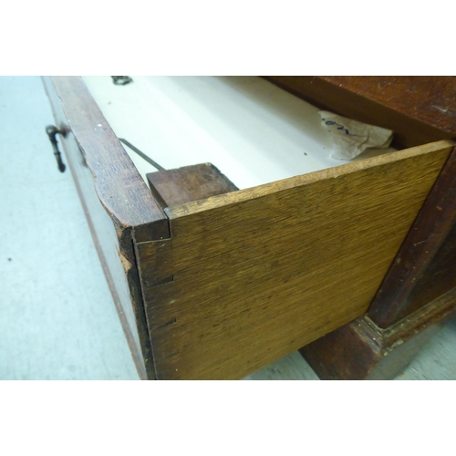 255 - An early 19thC oak mule chest, raised on bracket feet  34